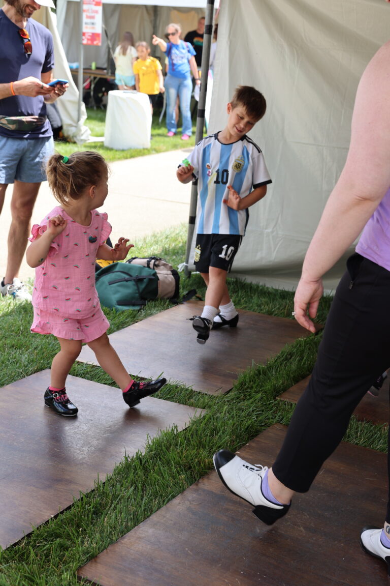 Participants try their hand at tap dancing at the Hands-On Activities Village